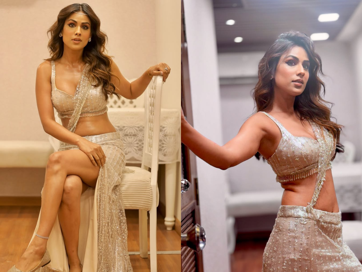 Nia Sharma gave a sexy pose sitting on a chair in a slit cut lehenga - Photo Gallery