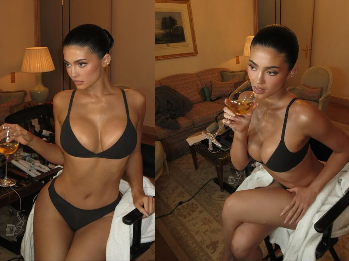 Sexy pose while drinking alcohol in a black bikini - Photo Gallery