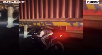 रोंगटे खड़े करने वाला वीडियो: ट्रक के निचे से बाइक निकालने का किया खतरनाक स्टंट, सोशल मीडिया पर मची हलचल!